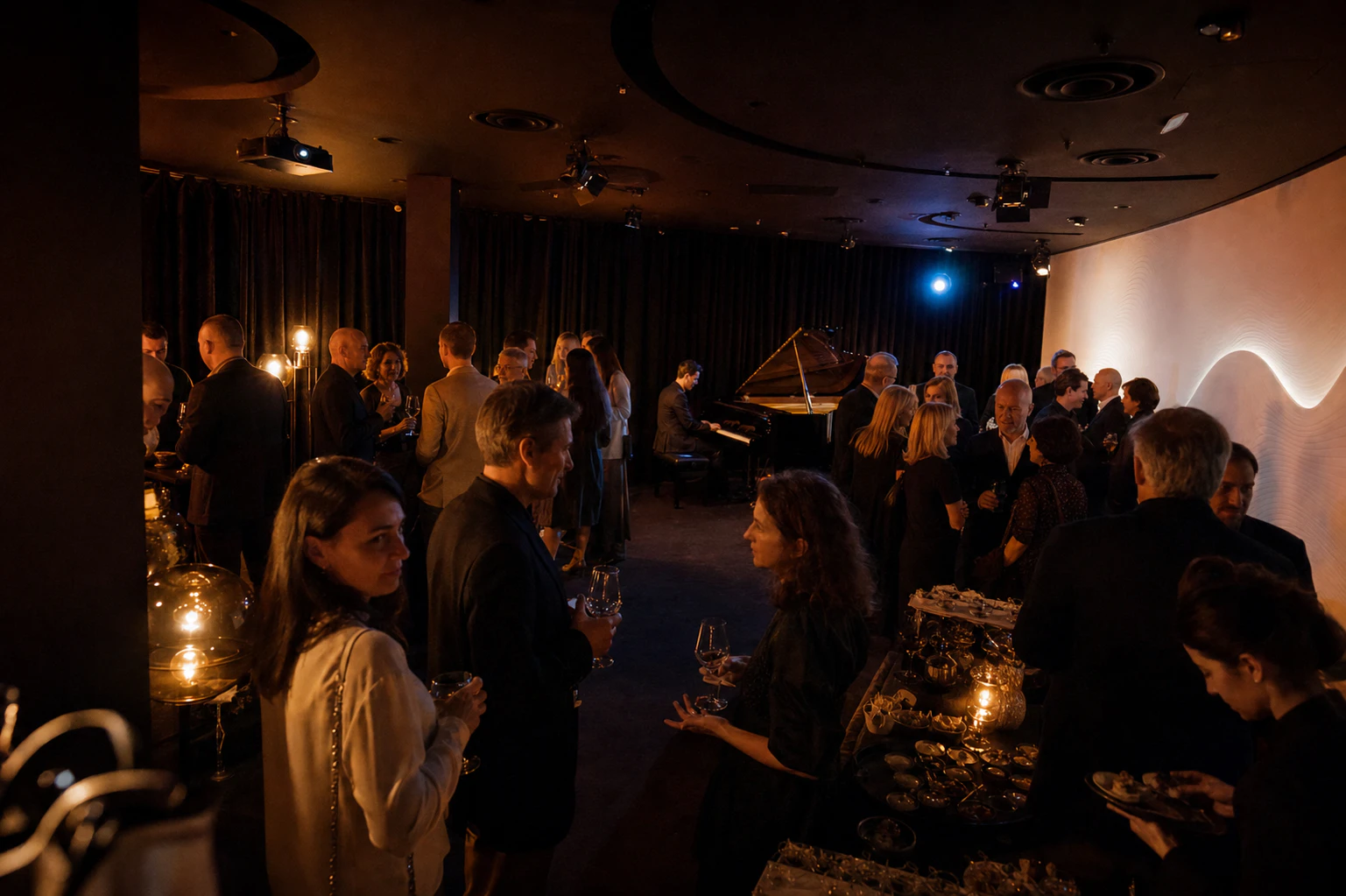 Guests gathering by the buffet and listening to a pianist at Downtown Piano Lab